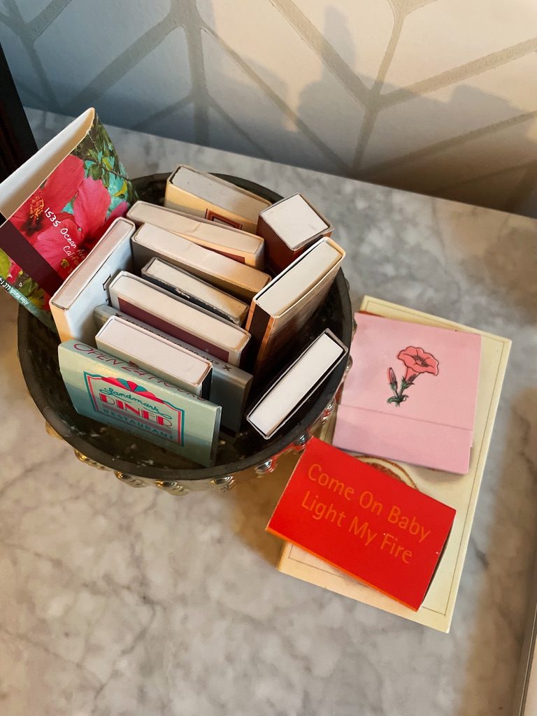 A bowl of matchbooks from restaurants and hotels
